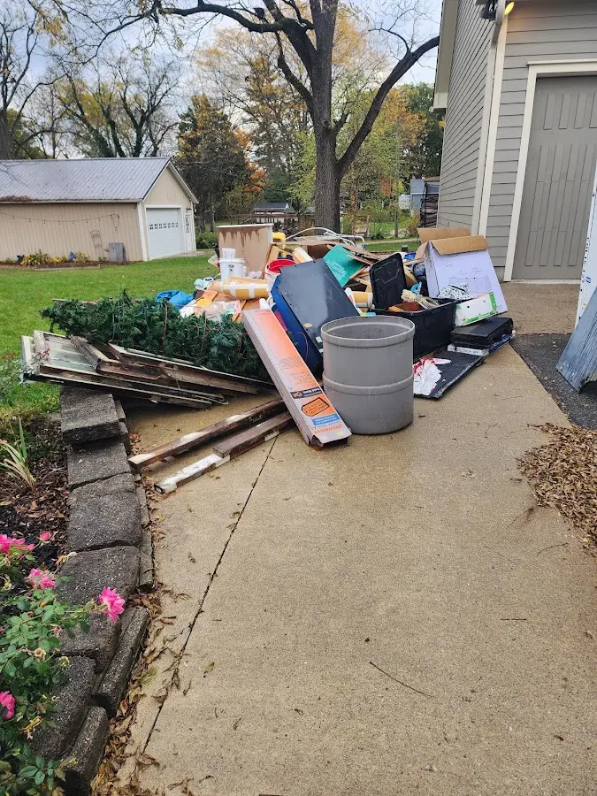 Dumpster being loaded with debris for 3 Yard Dumpster Rental in Fort Edward